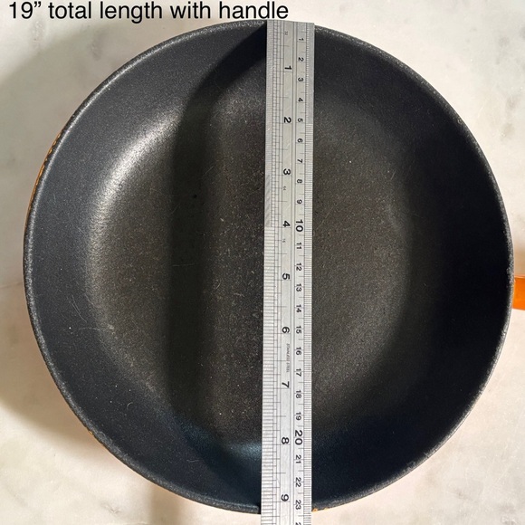 Le Creuset low heat enamelled cast iron skillet with nonstick coating in flame - Picture 5 of 5